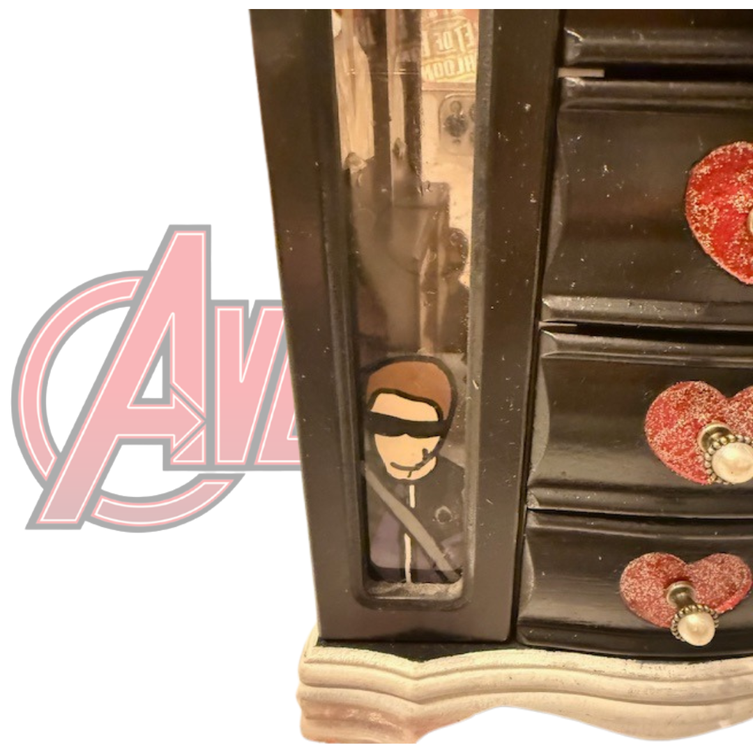 Close-up of Hawkeye artwork on Marvel jewelry box