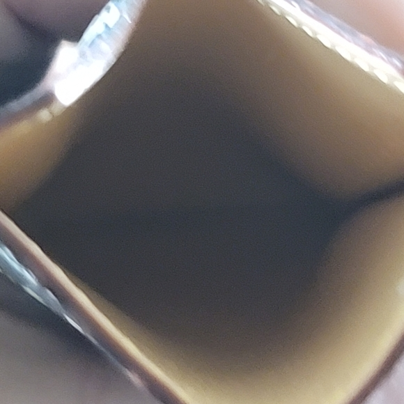 Interior view of the Louis Vuitton Murakami Noir Mirror Case showing the smooth leather lining and precise stitching.