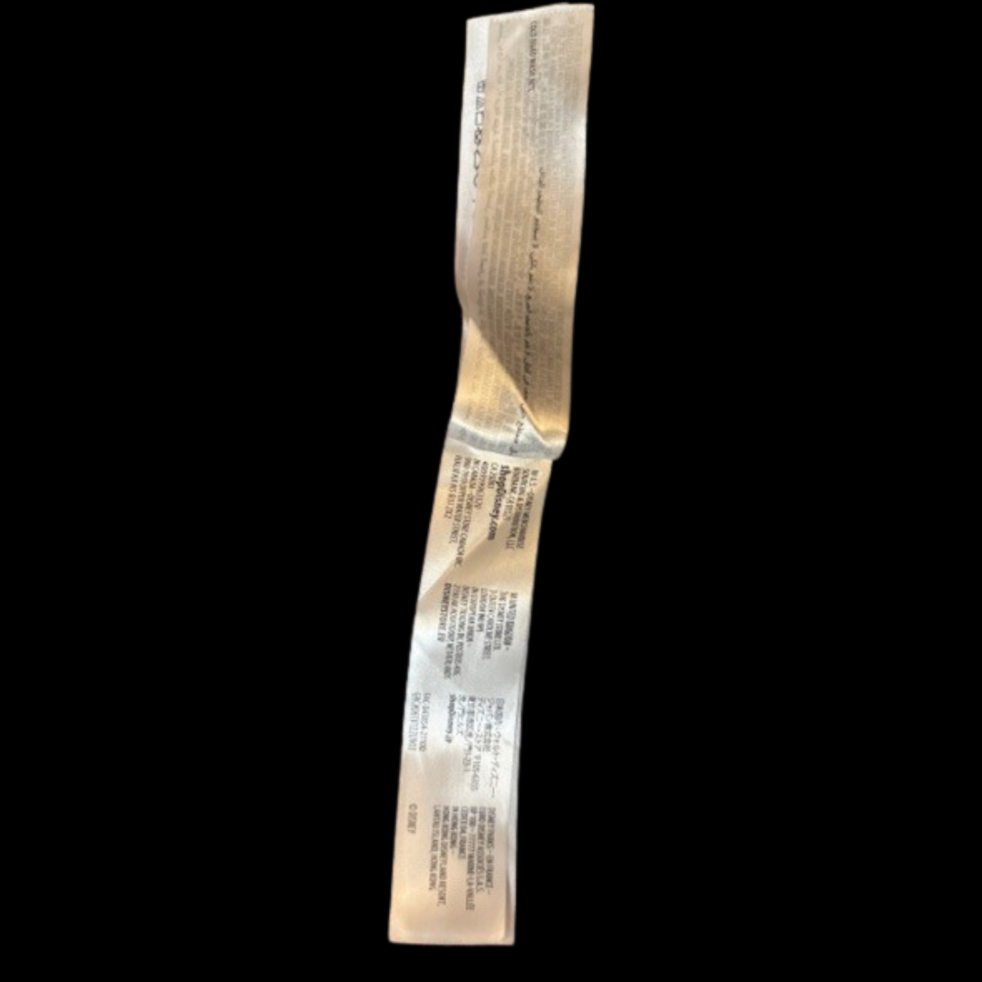 Close up of fabric content and care instructions tag for Disney Parks Spirit Jersey sweater