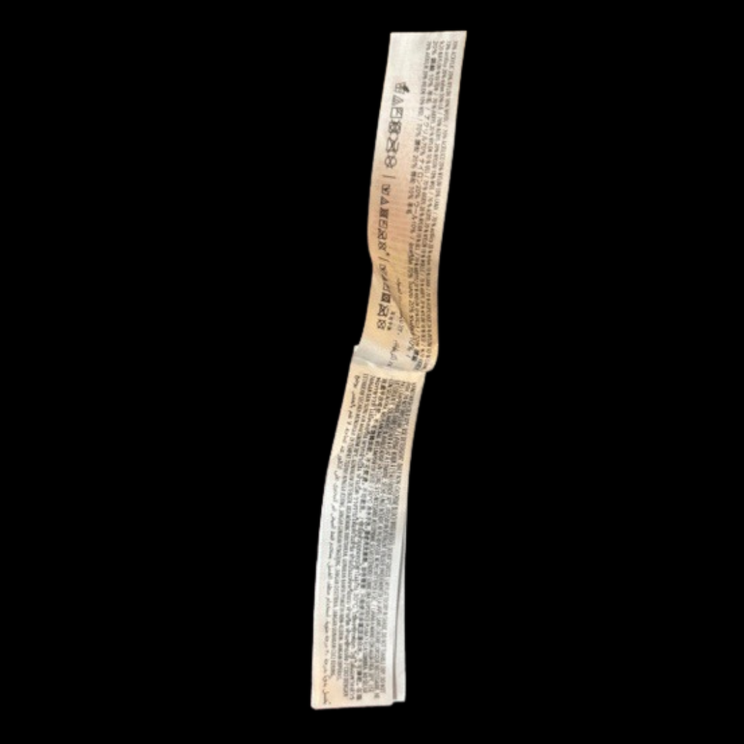 Reverse side of care tag with international washing symbols for Disney Parks Spirit Jersey sweater