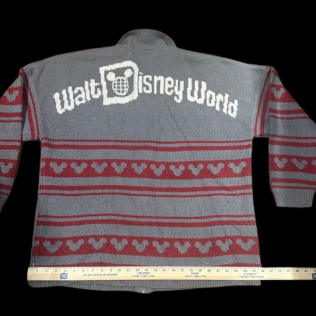 Back of Disney Parks Spirit Jersey sweater with measuring tape along the bottom hem for width
