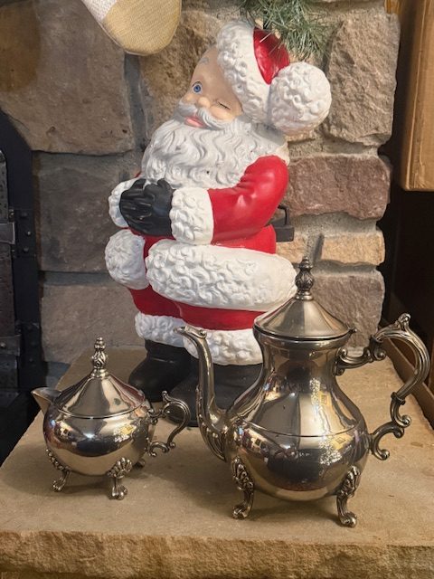 vintage-tea-service-coffee-pot-sugar-bowl-set.jpg Vintage silverplated tea service set including coffee pot and sugar bowl displayed together.