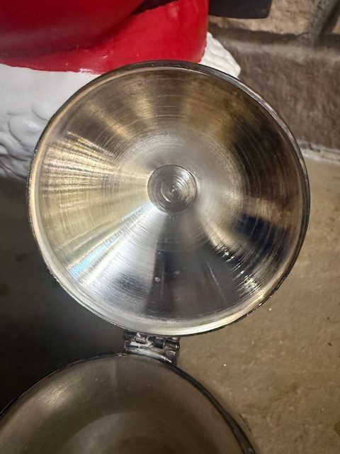silverplate-pot-lid-interior-brushed-metal.jpg Inside view of the vintage silverplated pot lid showing brushed circular metal texture.