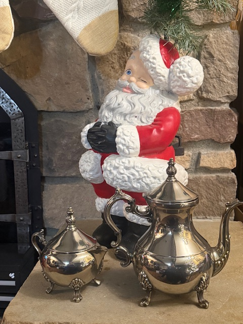 Vintage Silverplated Tea Set – Ornate Coffee Pot & Sugar Bowl Vintage silverplated tea and coffee set with ornate footed bases displayed in front of a stone fireplace at Twisted Gypsies Boutique.